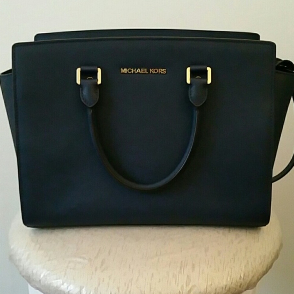 Michael Kors crossbody, medium size purse.